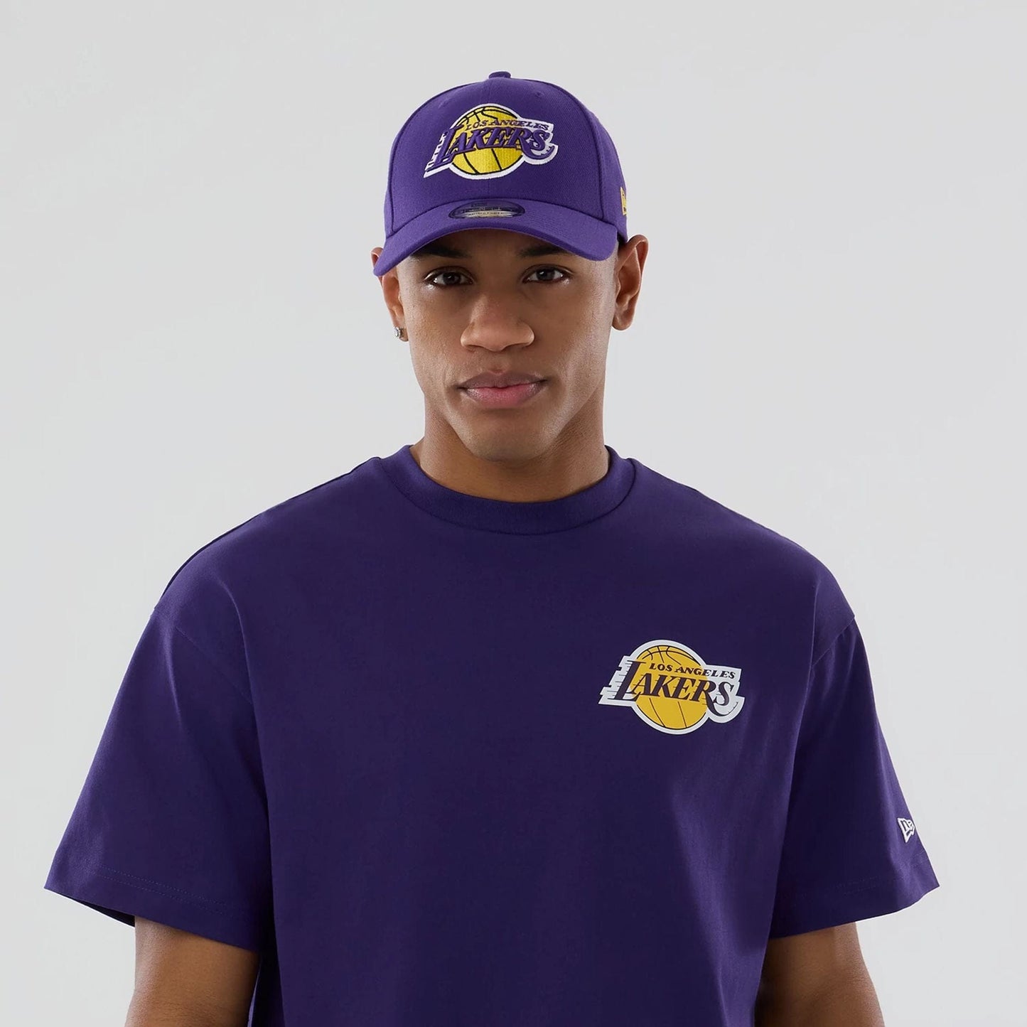 The model is wearing this NBA logo LA Lakers T-Shirt in purple. 7