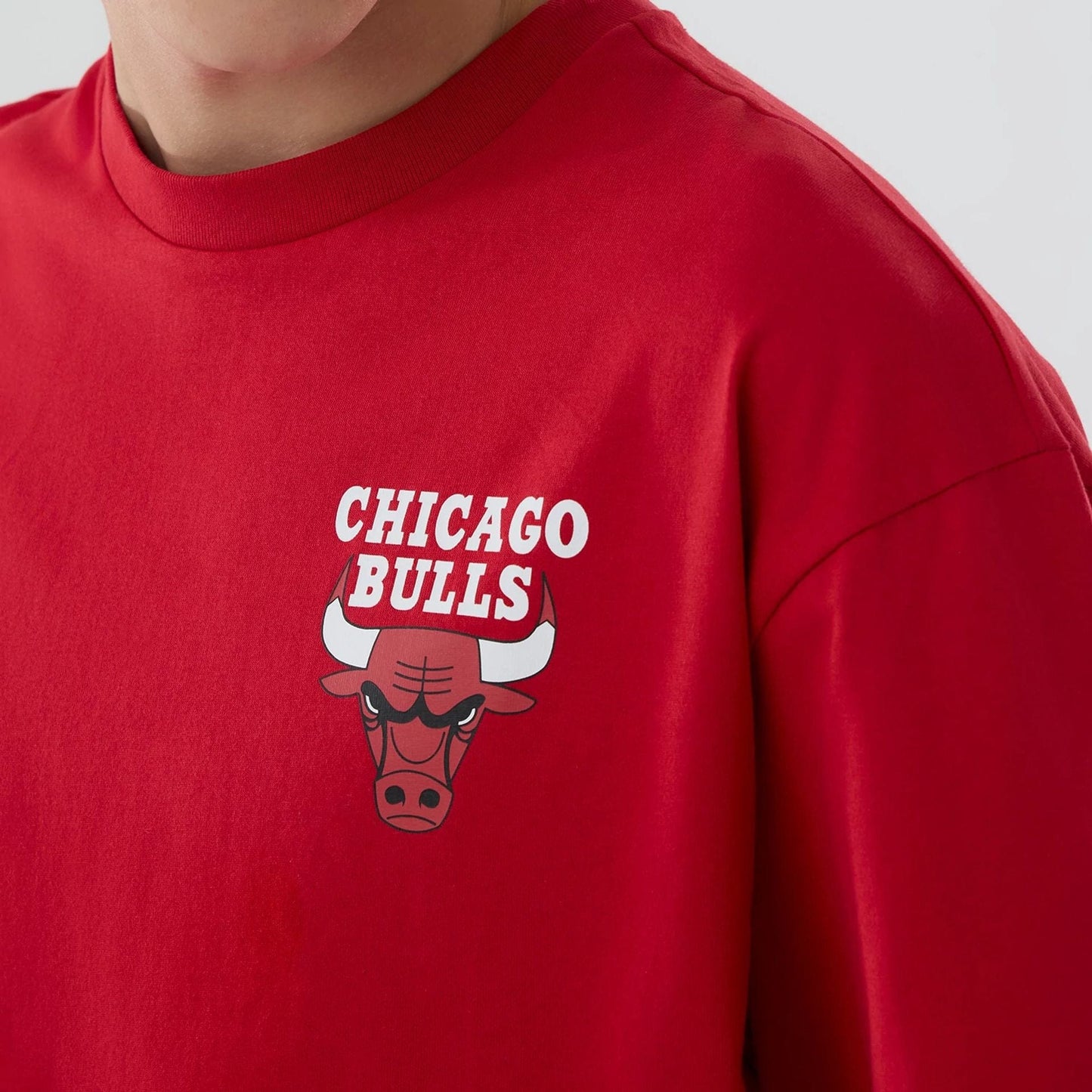 The model is wearing this NBA logo Chicago Bulls T-Shirt in red. 4