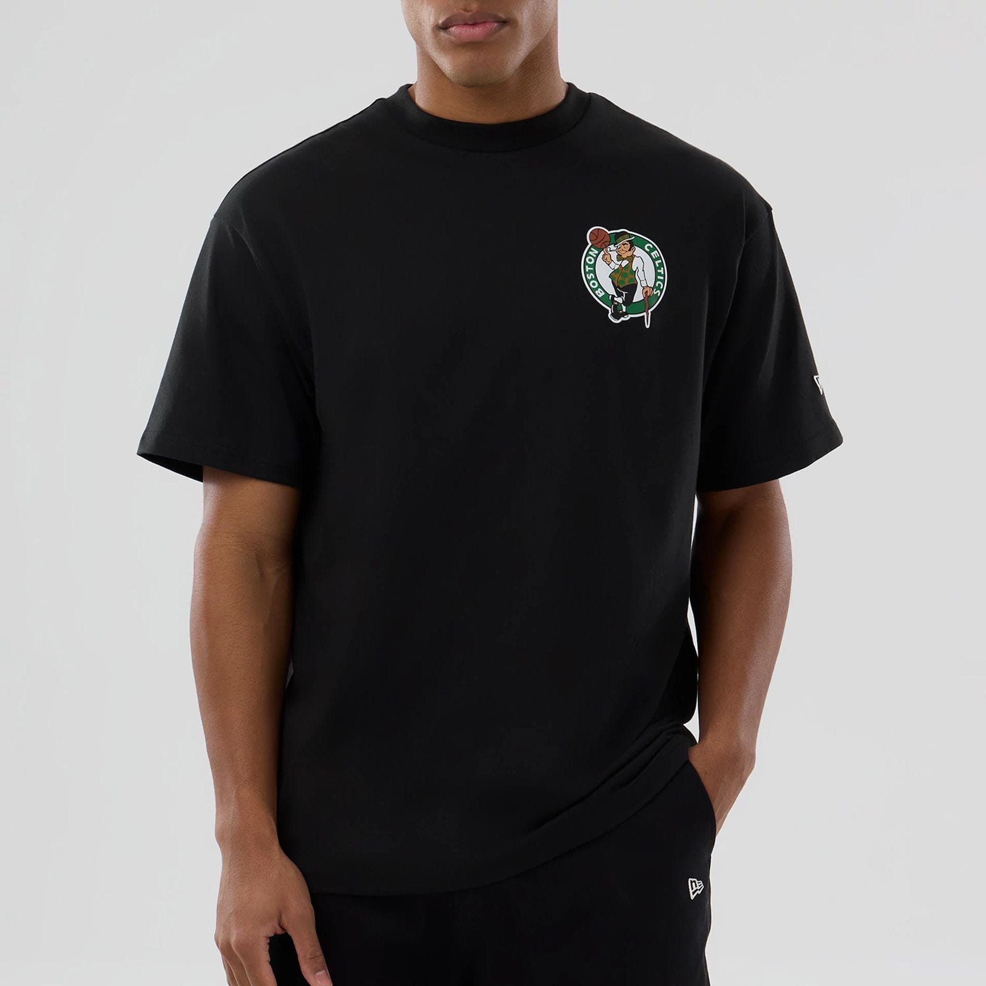 The model is wearing this NBA logo Boston Celtics T-Shirt in black. 7