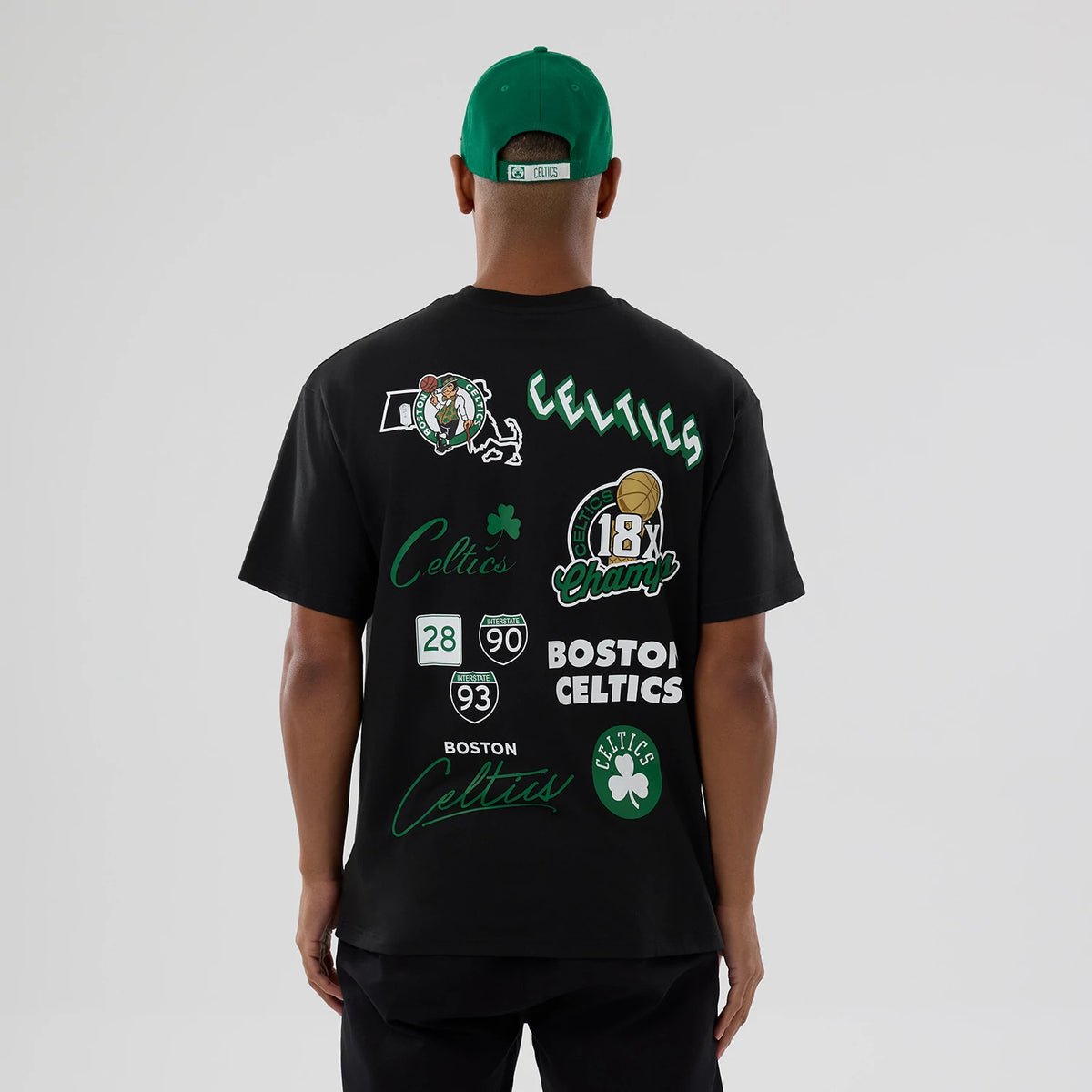 The model is wearing this NBA logo Boston Celtics T-Shirt in black. 2