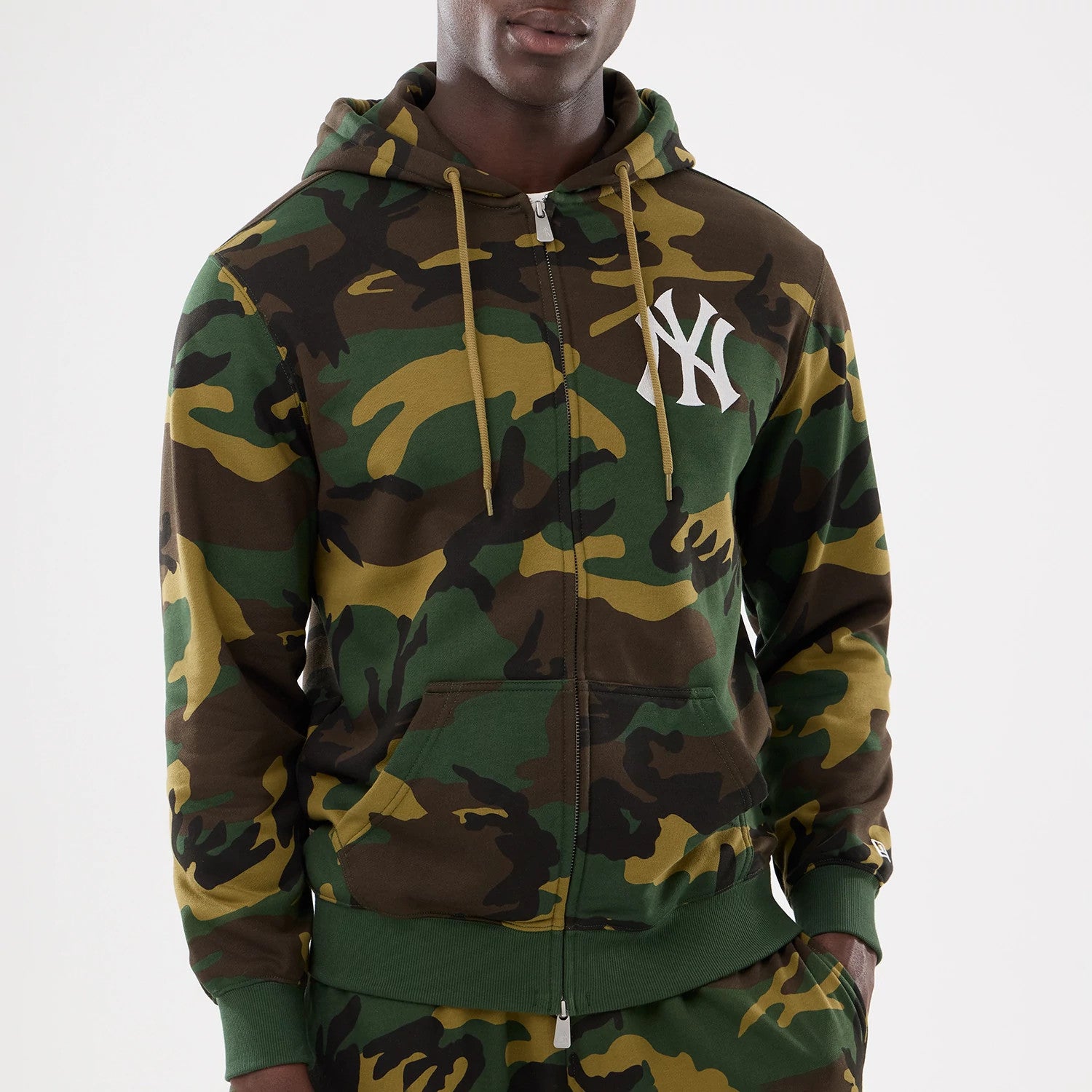 The model is wearing this MLB Camo New York Yankees 2 Way Full Zip Hoodie in Woodland Camo. 4