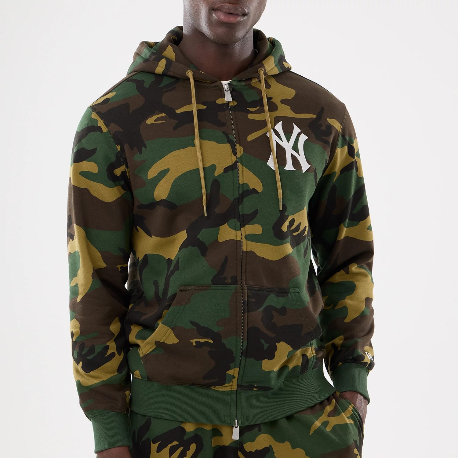The model is wearing this MLB Camo New York Yankees 2 Way Full Zip Hoodie in Woodland Camo. 4