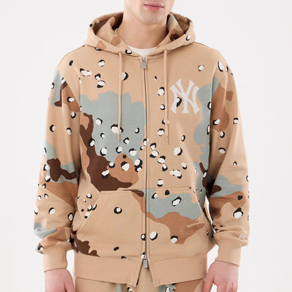 New York Yankees MLB Desert Camo 2 Way Full Zip Hoodie, front view showing the desert camo pattern in tan, green, and brown with a white New York Yankees logo on the chest and a debossed New Era logo on the cuff.