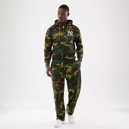The model is wearing this New Era Woodland Camo Joggers in Woodland Camo. 8