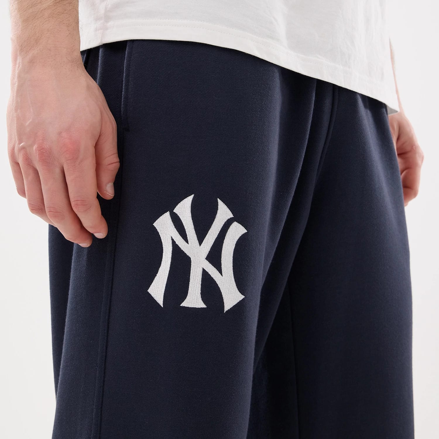 The model is wearing this MLB Comfort New York Yankees Joggers in blue. 3
