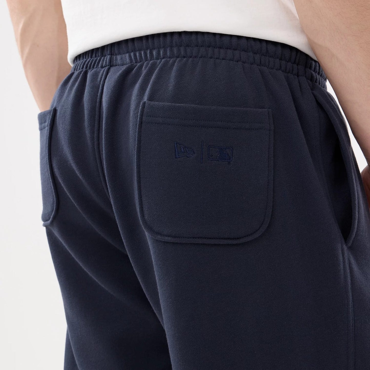 The model is wearing this MLB Comfort New York Yankees Joggers in blue. 5