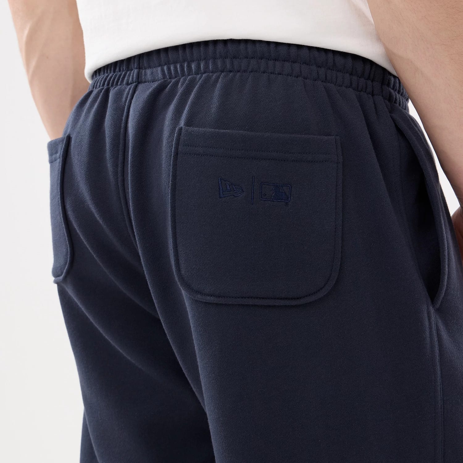 The model is wearing this MLB Comfort New York Yankees Joggers in blue. 5