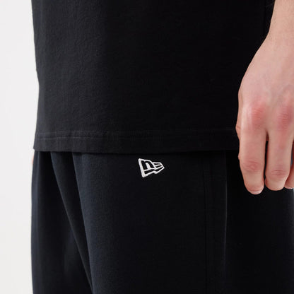 The model is wearing this MLB Comfort New York Mets Joggers in black. 4