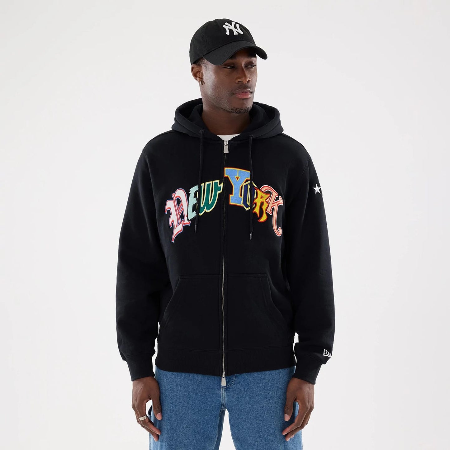 The model is wearing this MLB Word Art New York Yankees 2 Way Full Zip Hoodie in black. 1