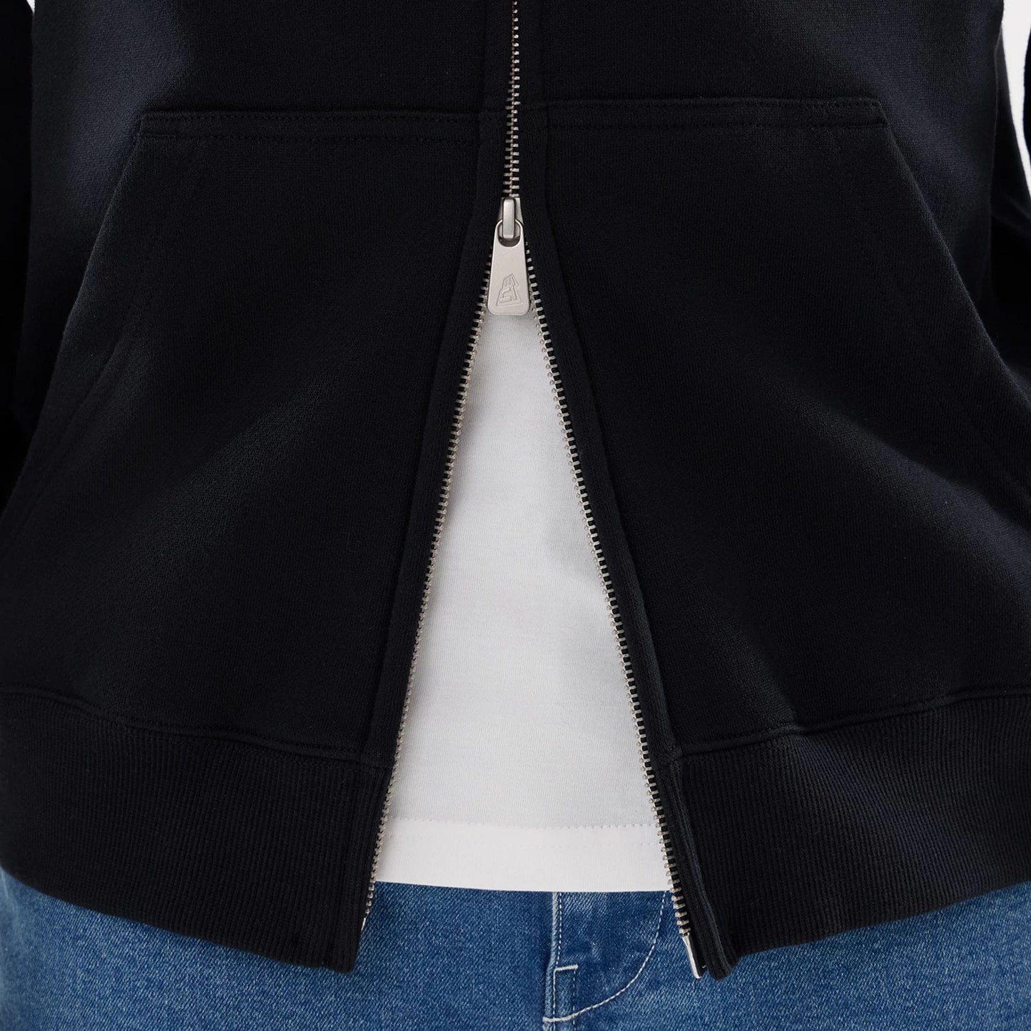 The model is wearing this MLB Word Art New York Yankees 2 Way Full Zip Hoodie in black. 6