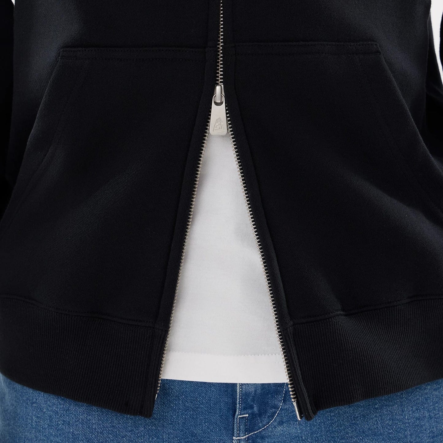 The model is wearing this MLB Word Art New York Yankees 2 Way Full Zip Hoodie in black. 6