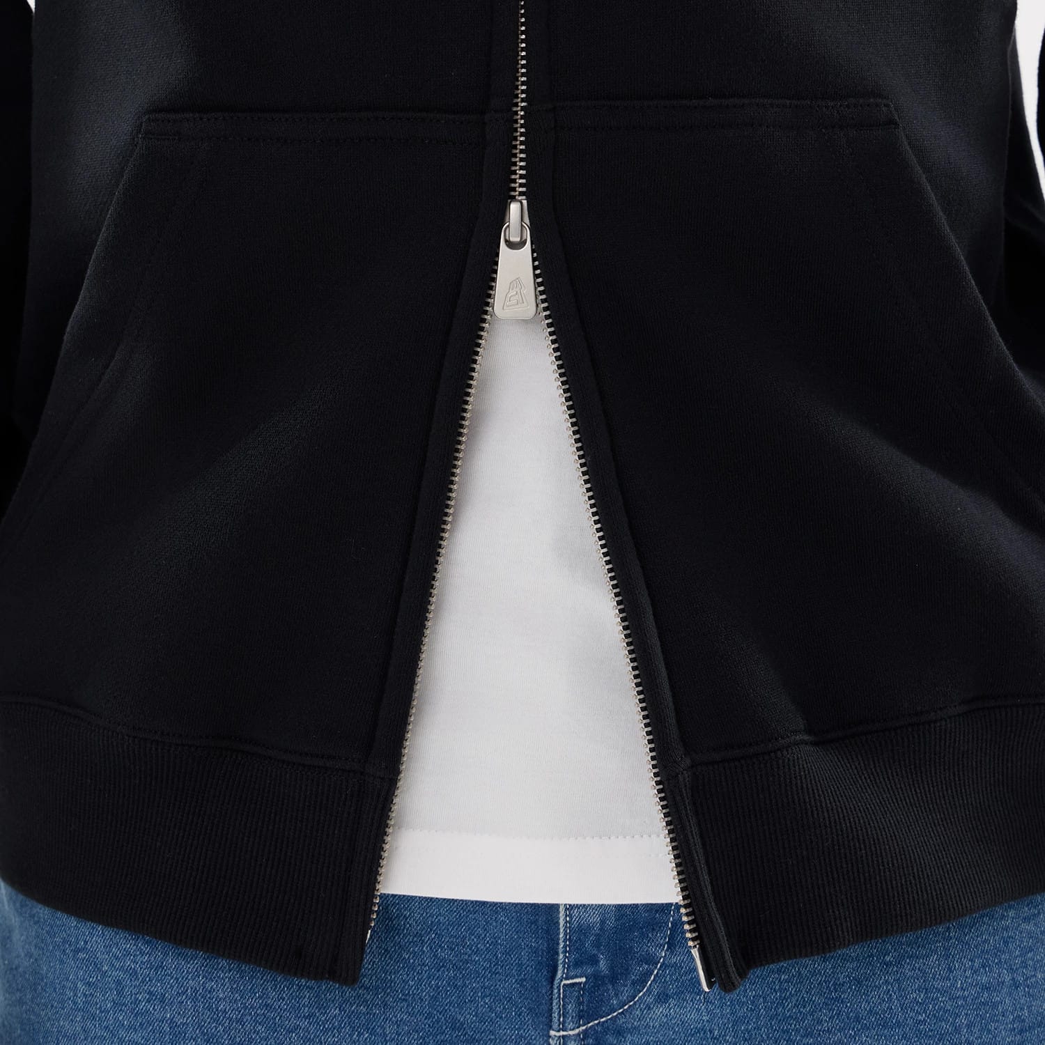 The model is wearing this MLB Word Art New York Yankees 2 Way Full Zip Hoodie in black. 6