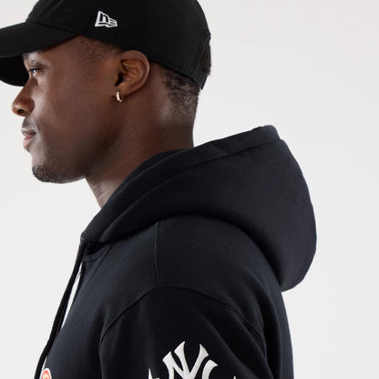 The model is wearing this MLB Word Art New York Yankees 2 Way Full Zip Hoodie in black. 7