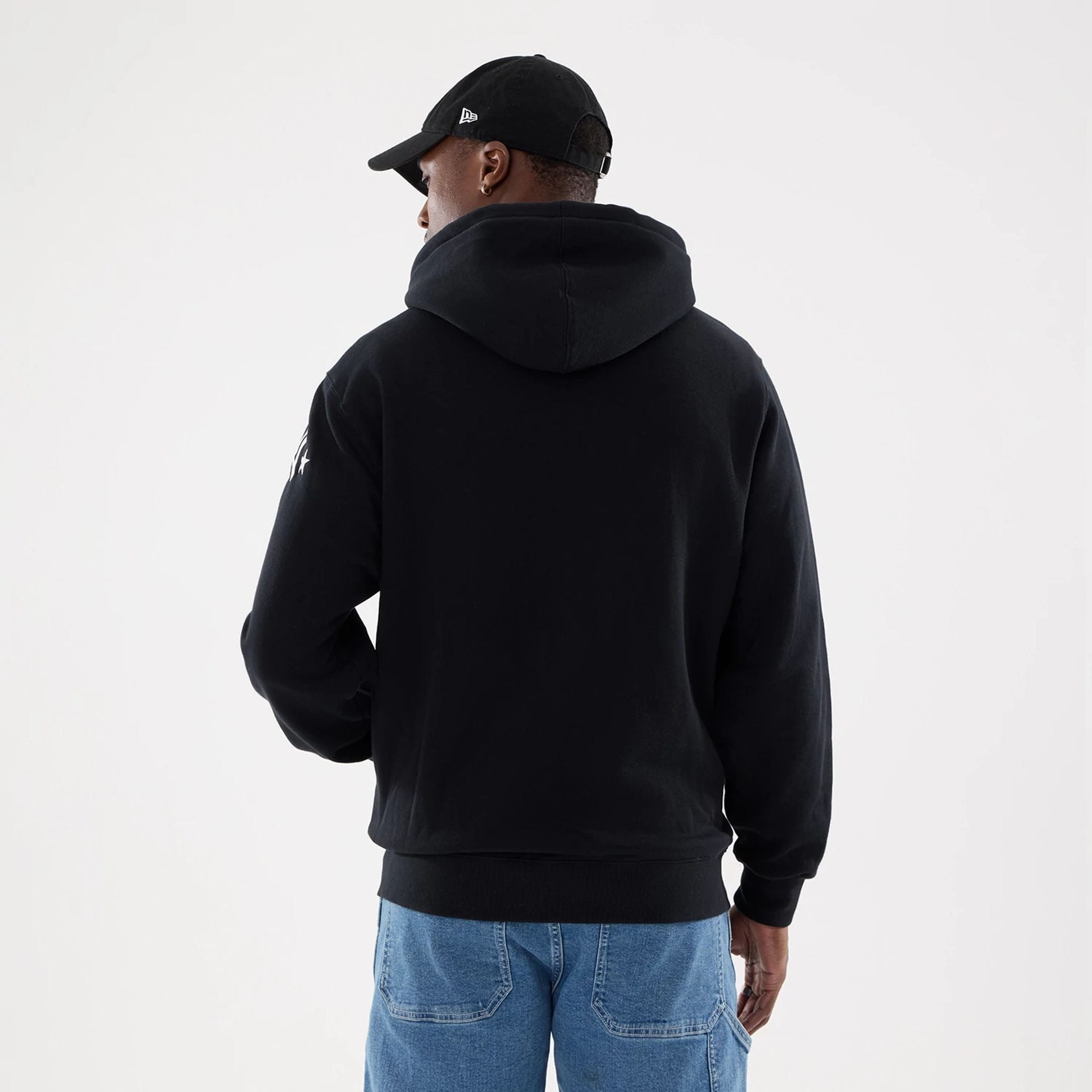 The model is wearing this MLB Word Art New York Yankees 2 Way Full Zip Hoodie in black. 2
