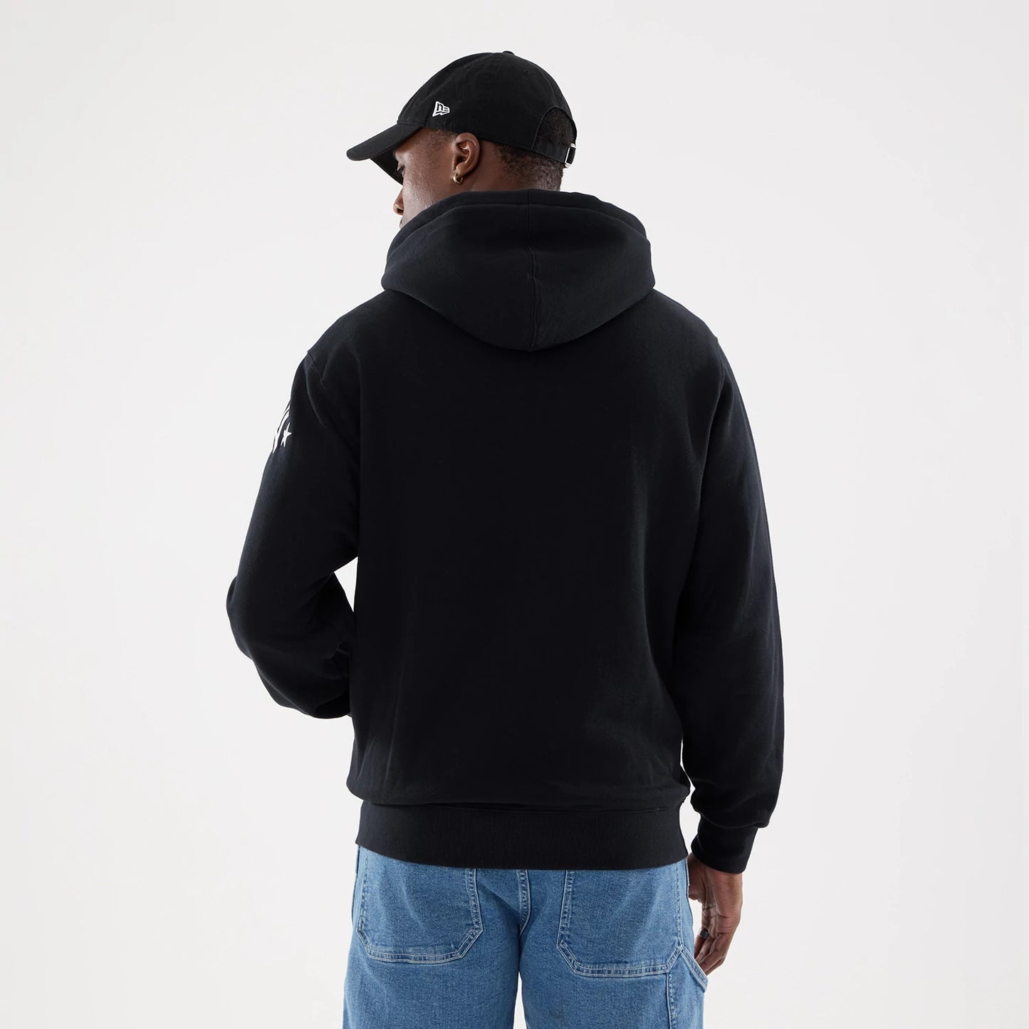 The model is wearing this MLB Word Art New York Yankees 2 Way Full Zip Hoodie in black. 2