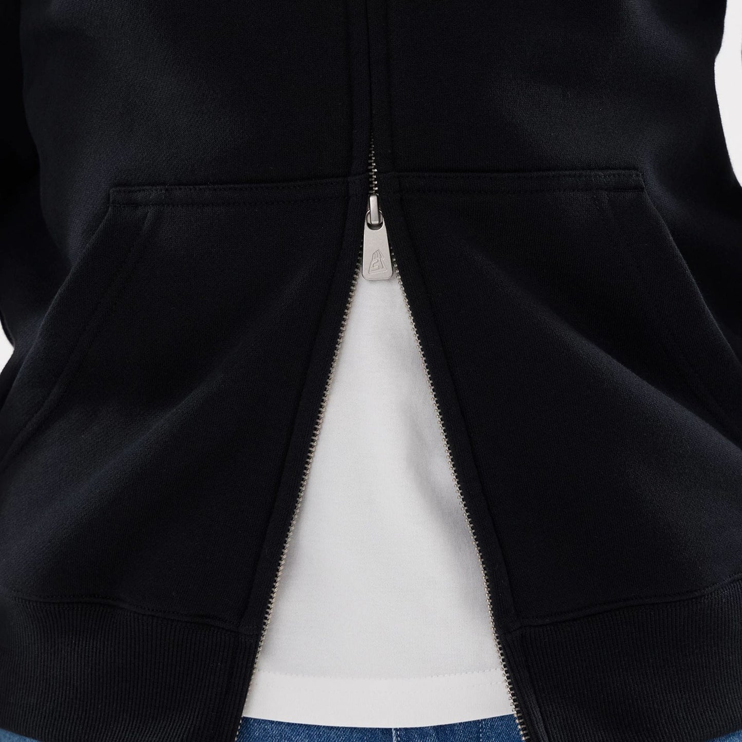 The model is wearing this MLB Word Art Las Vegas Raiders 2 Way Full Zip Hoodie in black. 6