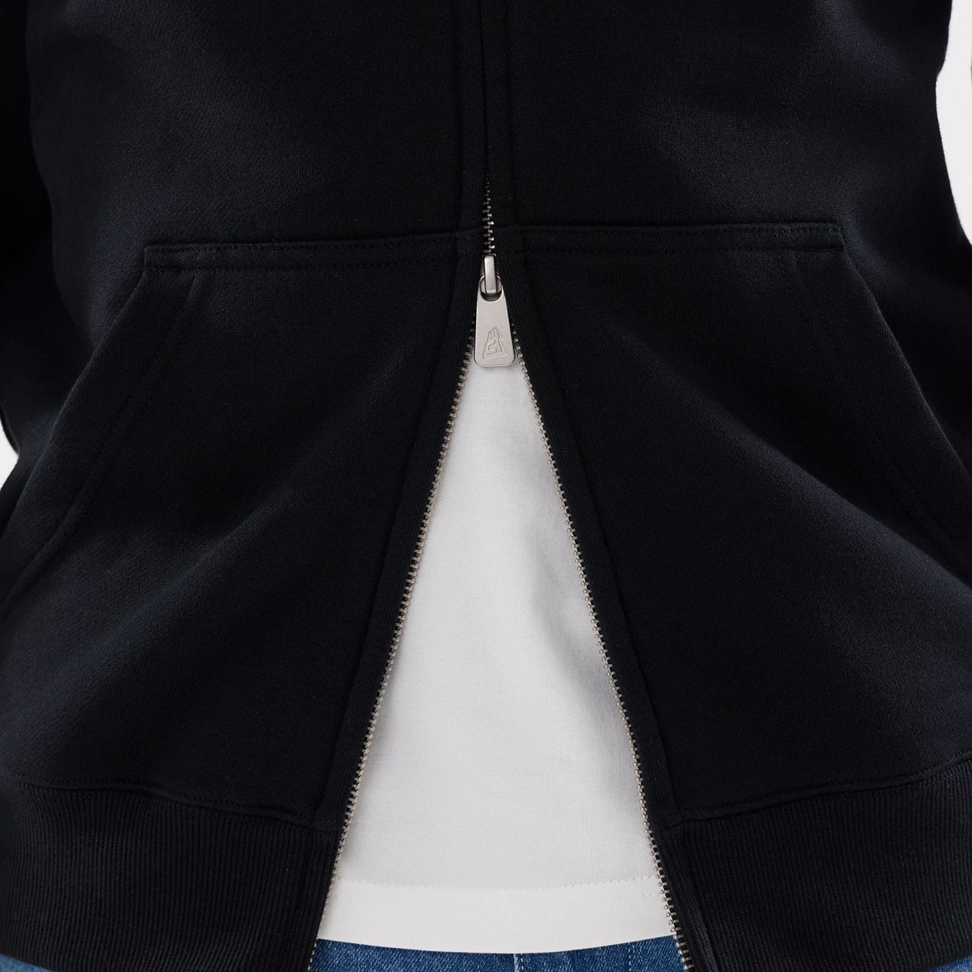The model is wearing this MLB Word Art Las Vegas Raiders 2 Way Full Zip Hoodie in black. 6