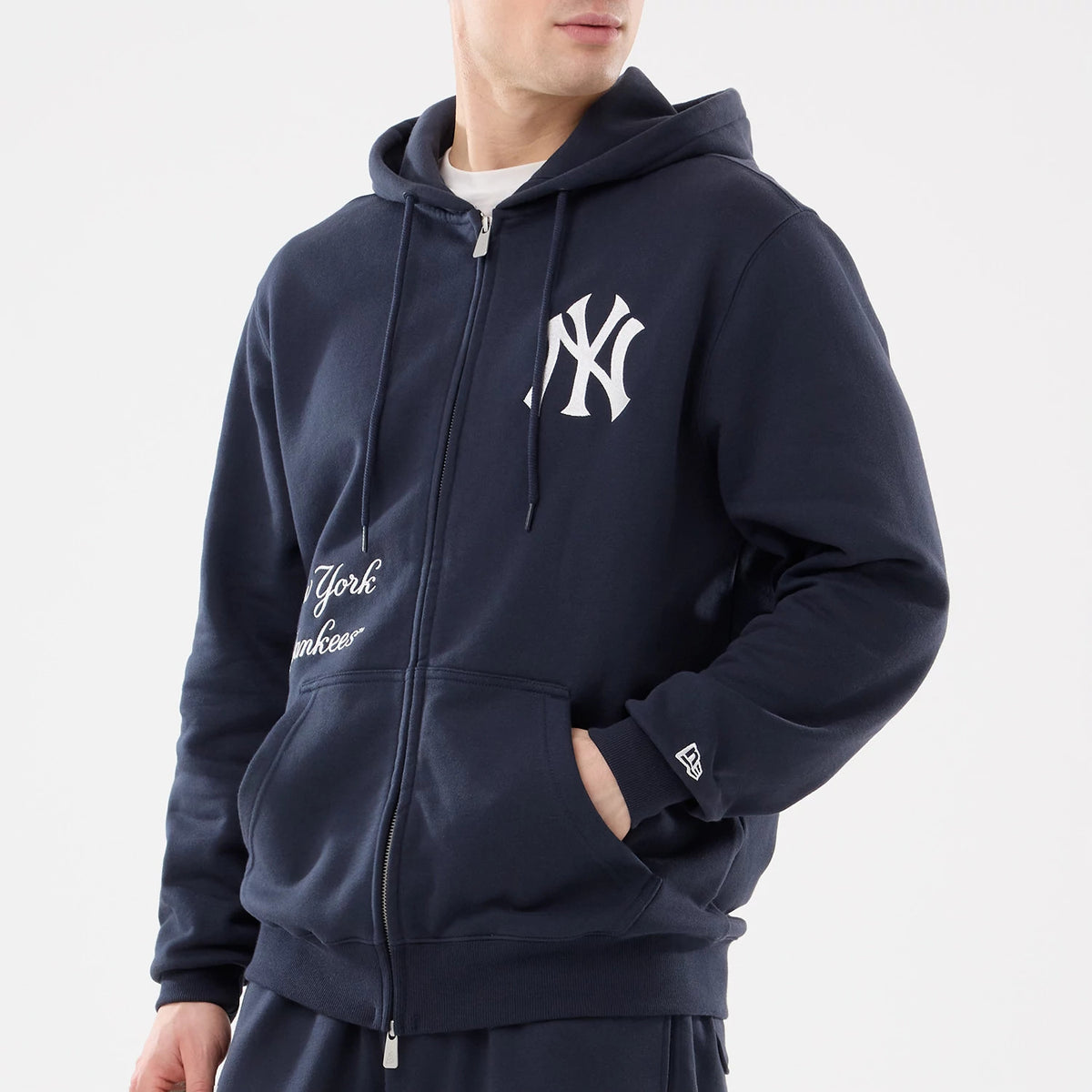 New York Yankees MLB Comfort Navy 2 Way Full Zip Hoodie, front view showing a raised white New York Yankees logo on the left chest, full zip down the centre, kangaroo pocket, and a small raised New Era logo on the left sleeve cuff.