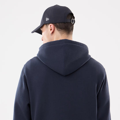New York Yankees MLB Comfort Navy 2 Way Full Zip Hoodie, on-model rear view showing the dark navy hood and back, with a raised New Era logo on the side of a matching navy cap worn by the model.