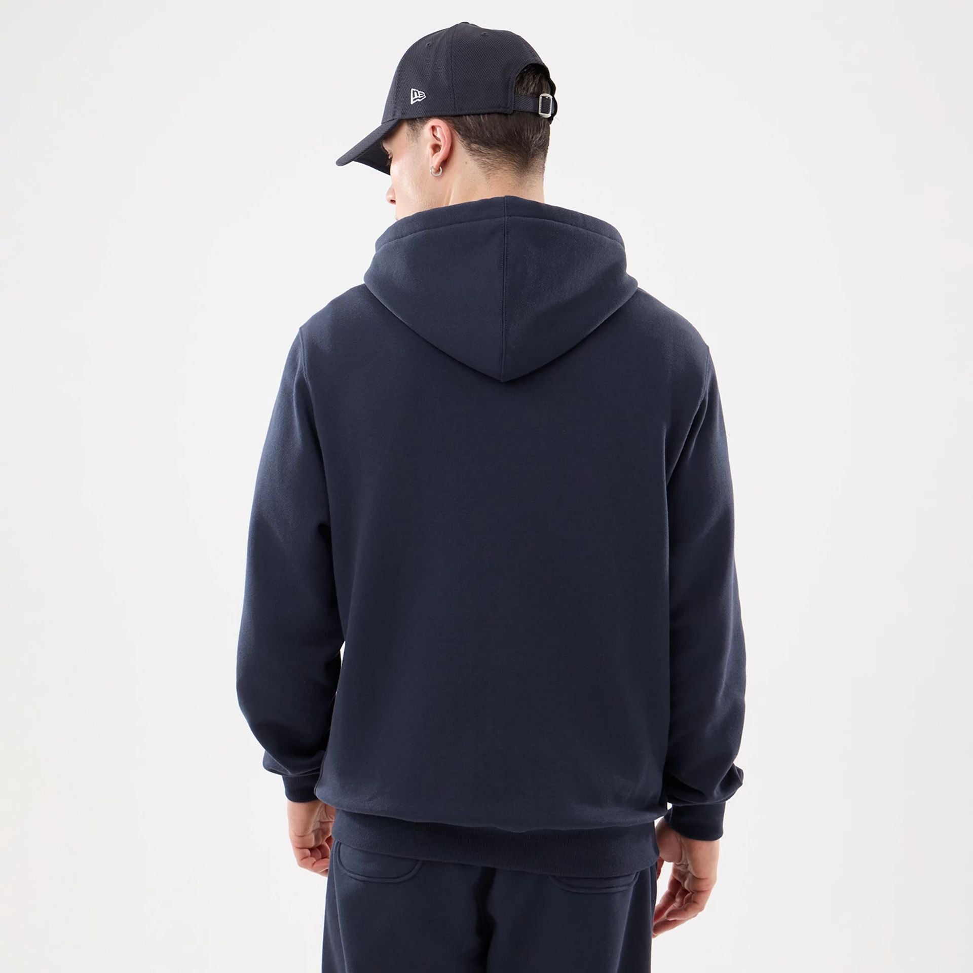 The model is wearing this MLB Comfort New York Yankees 2 Way Full Zip Hoodie in navy. 2