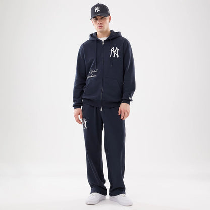 The model is wearing this MLB Comfort New York Yankees 2 Way Full Zip Hoodie in navy. 8