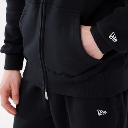 The model is wearing this MLB Comfort New York Mets 2 Way Full Zip Hoodie in black. 6