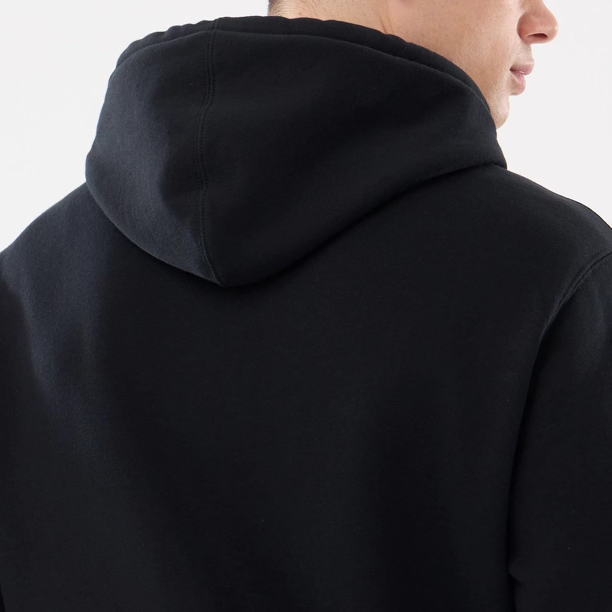New York Mets MLB Comfort Black 2 Way Full Zip Hoodie, rear view showing the plain black hood from behind, with a seamless connection to the body, covering the back of the neck and shoulders.