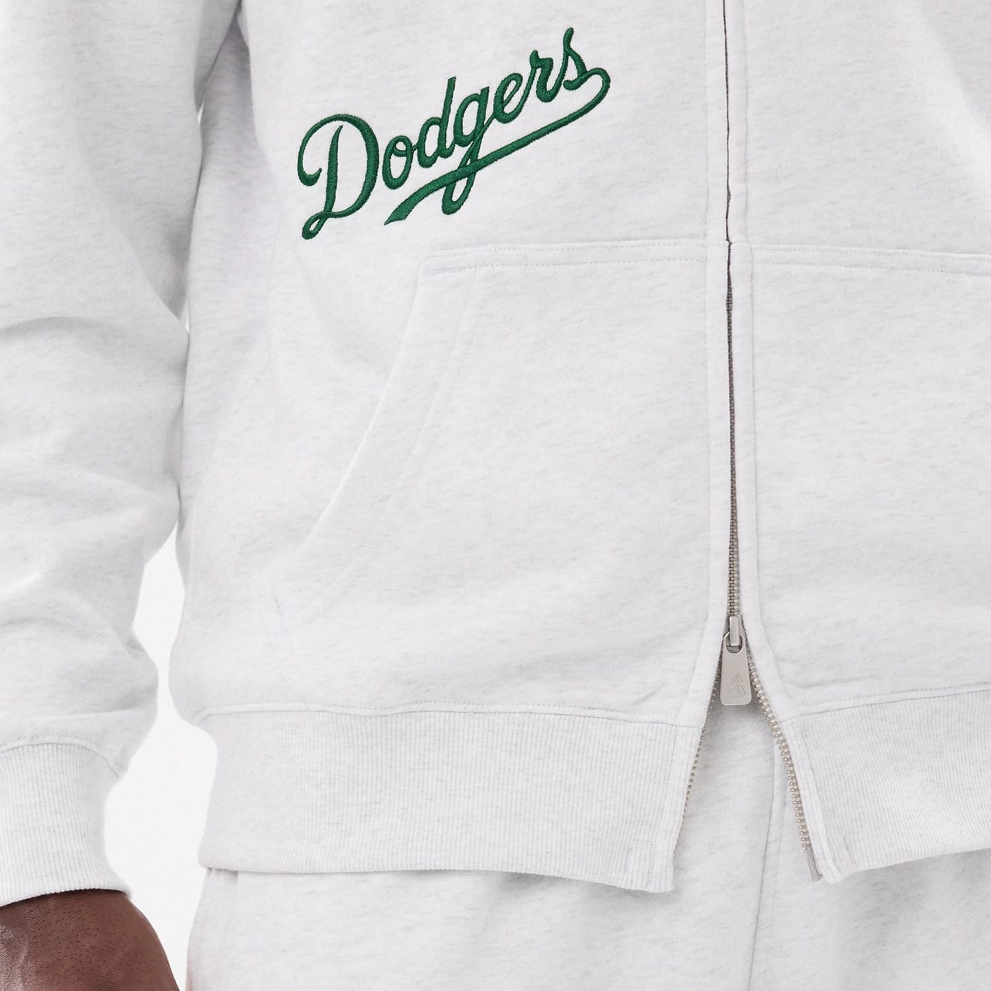 The model is wearing this MLB Comfort LA Dodgers 2 Way Full Zip Hoodie in grey. 6