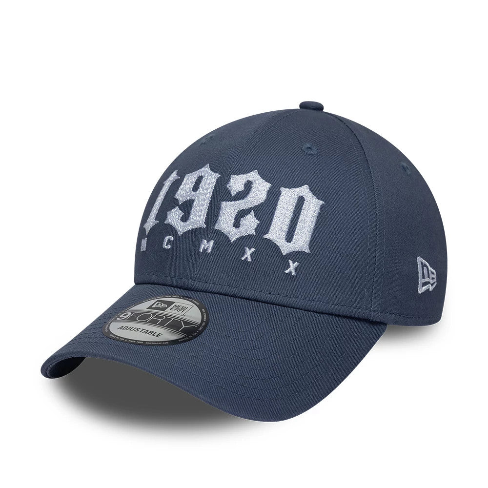 Pictured is this New Era Street Archived 9FORTY cap in dark blue. 1
