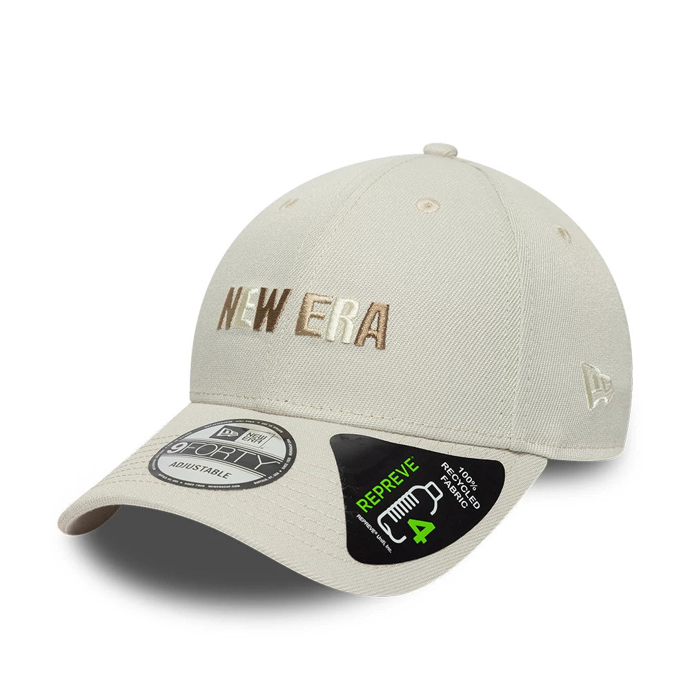 New Era Earth Day Beige 9FORTY Adjustable Cap, front view showing brown and white raised embroidery of the New Era logo on the crown, curved visor with a 9FORTY size sticker, and a New Era flag logo on the left side.