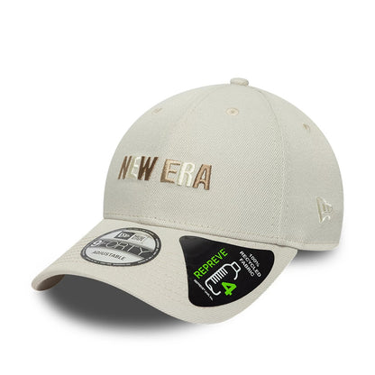 New Era Earth Day Beige 9FORTY Adjustable Cap, front view showing brown and white raised embroidery of the New Era logo on the crown, curved visor with a 9FORTY size sticker, and a New Era flag logo on the left side.