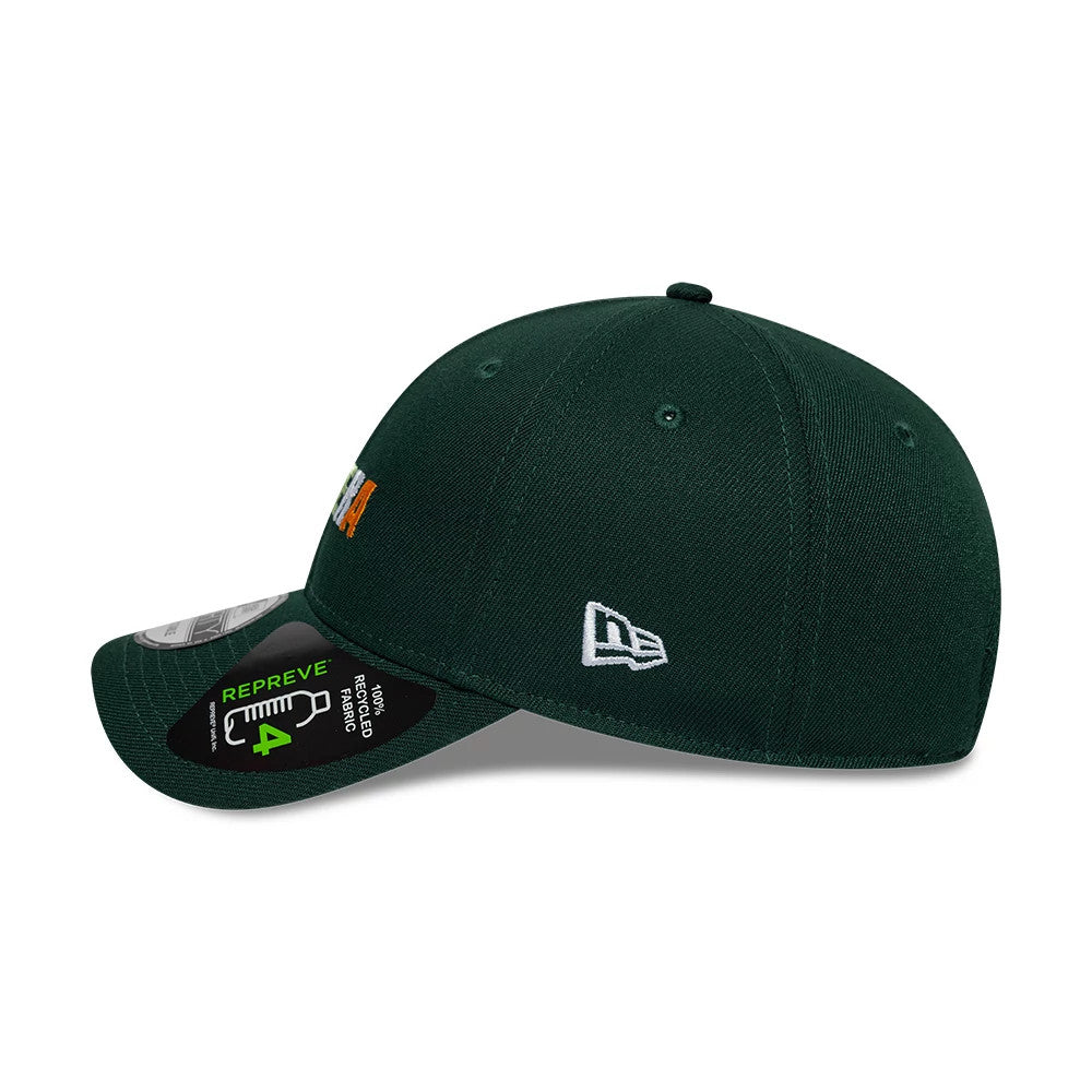 New Era Earth Day Dark Green 9FORTY Adjustable Cap, side view showing the embroidered white New Era flag logo on the left side, with a rounded crown and a curved visor featuring a Repreve fabric label.