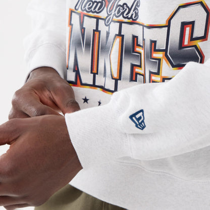 The model is wearing this MLB Retro New York Yankees Oversized Crew Neck Sweater in White 5