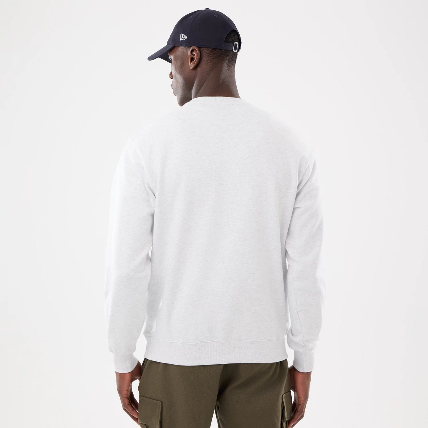 The model is wearing this MLB Retro New York Yankees Oversized Crew Neck Sweater in White 2