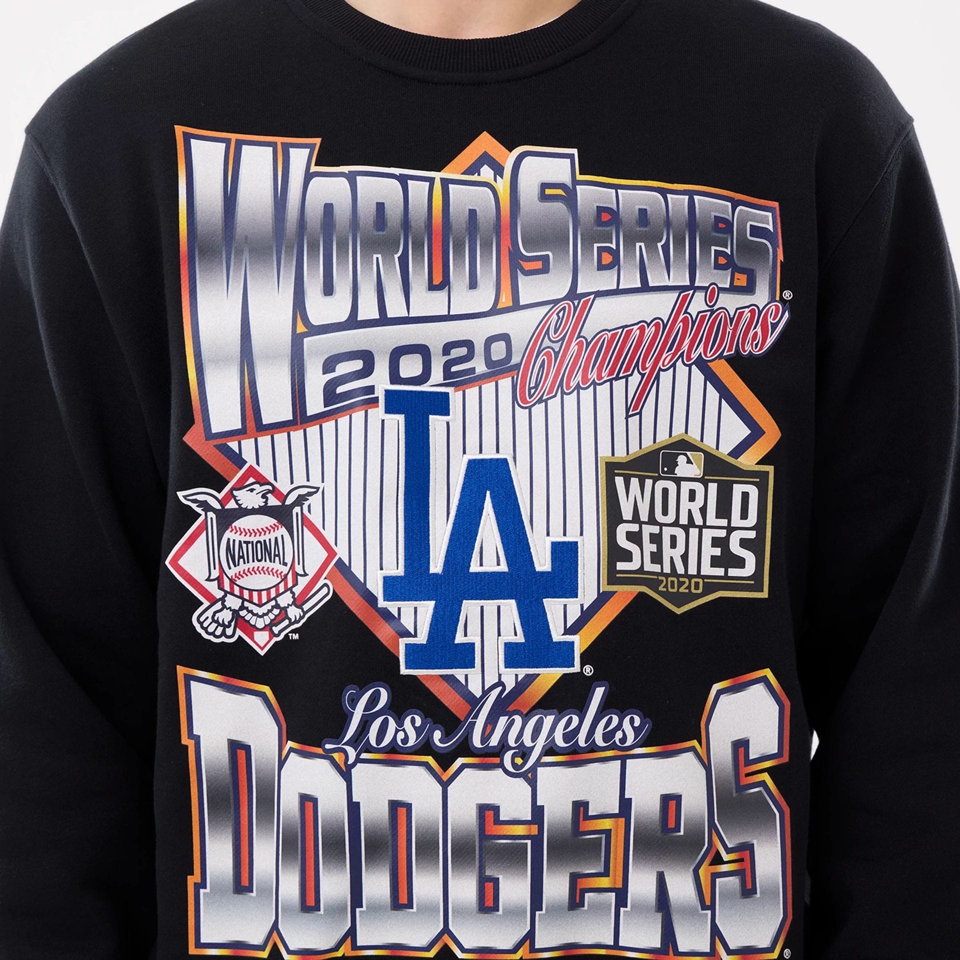 The model is wearing this MLB Retro LA Dodgers Oversized Crew Neck Sweater in black. 5