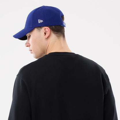 The model is wearing this MLB Retro LA Dodgers Oversized Crew Neck Sweater in black. 7