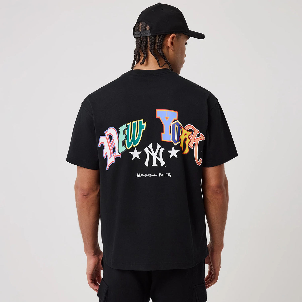 The model is wearing this MLB Word Art New York Yankees T-Shirt in black. 2