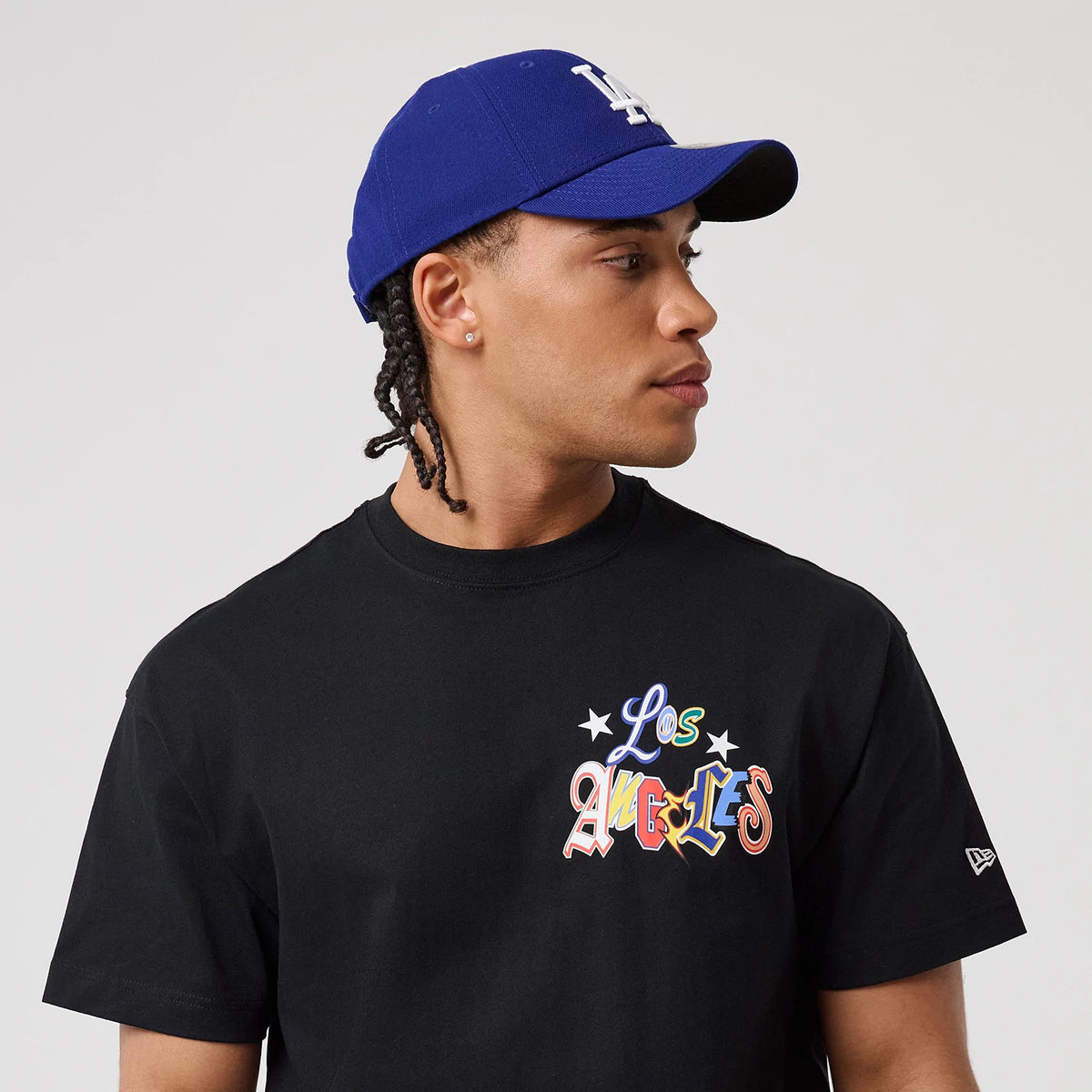 The model is wearing this MLB Word Art LA Dodgers T-Shirt in black. 6