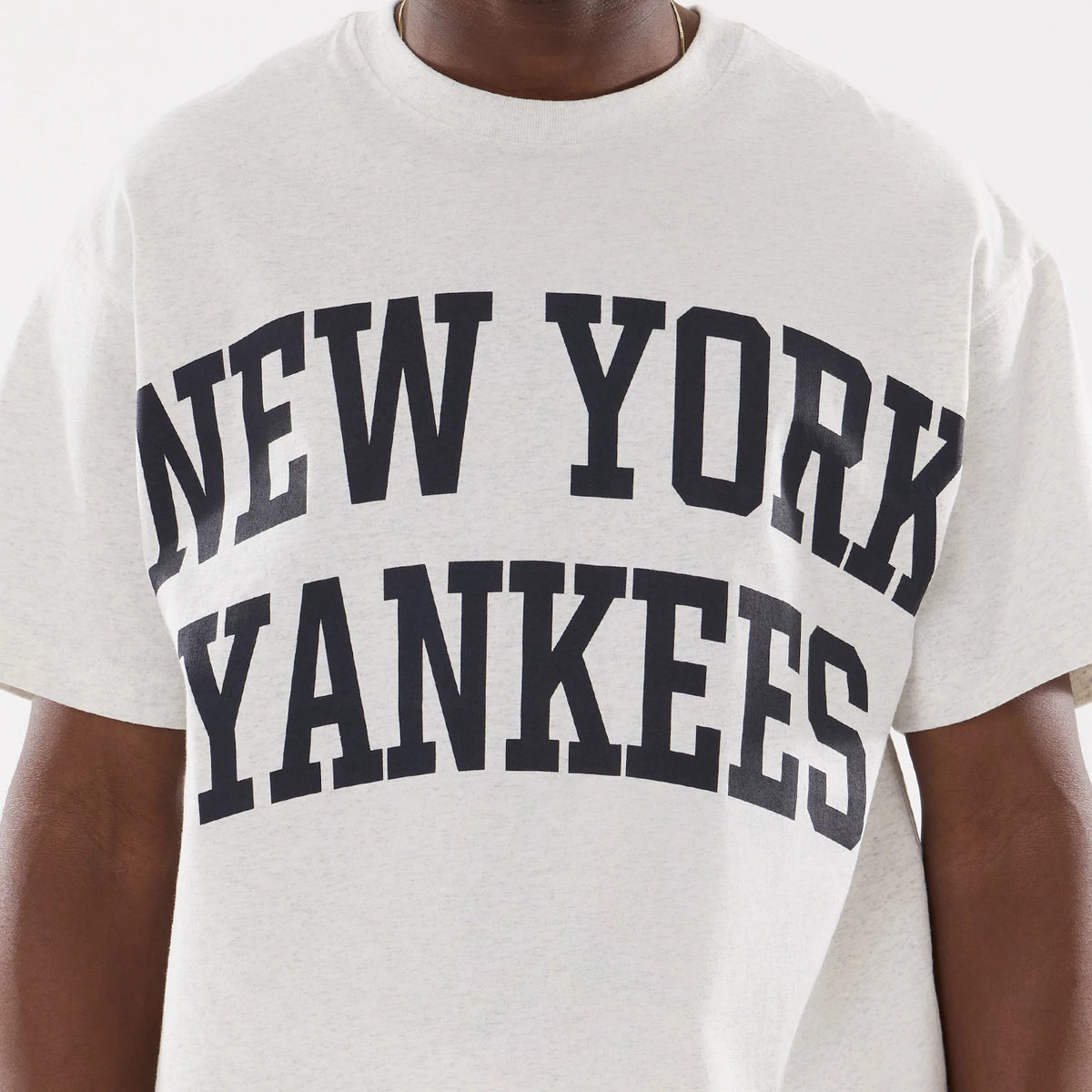 New Era New York Yankees MLB Comfort Grey T-Shirt, front view showing large black New York Yankees text arched across the chest on a plain grey background with a simple crew neckline.