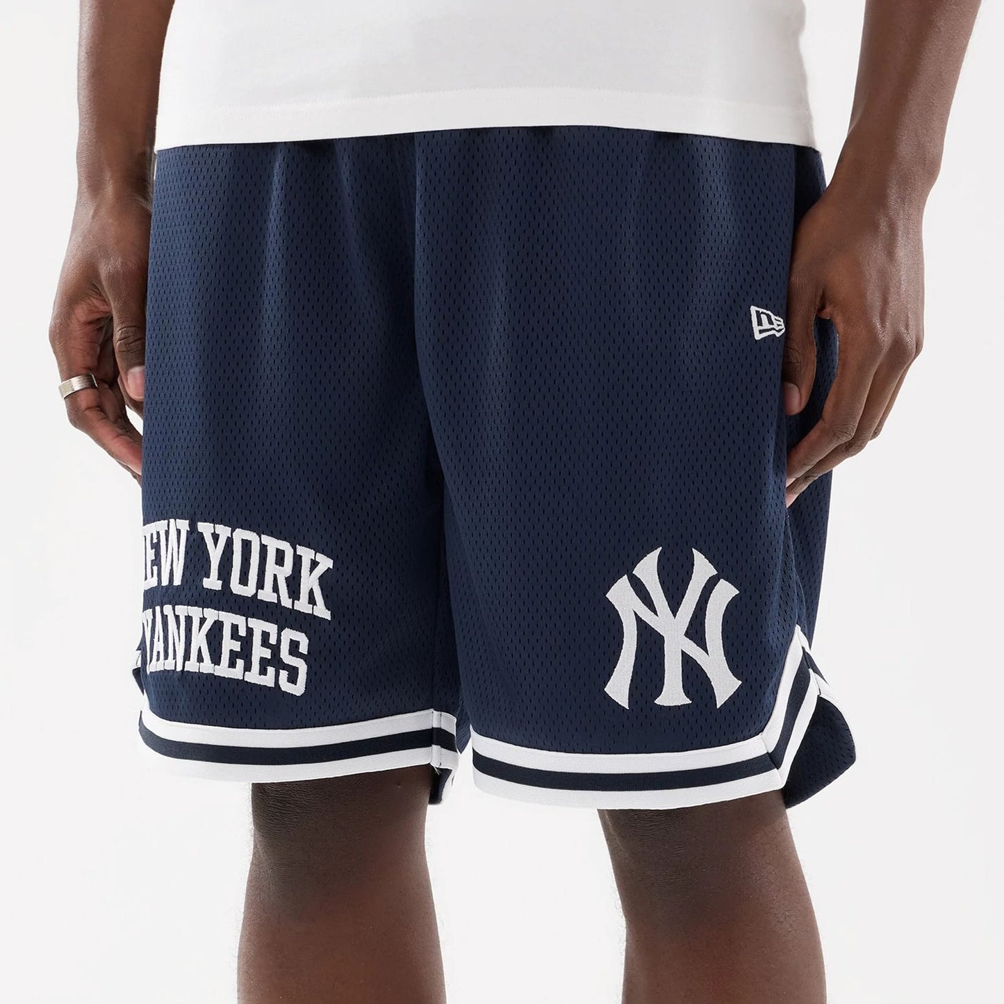 The model is wearing this MLB Comfort New York Yankees Oversized Shorts in navy. 3