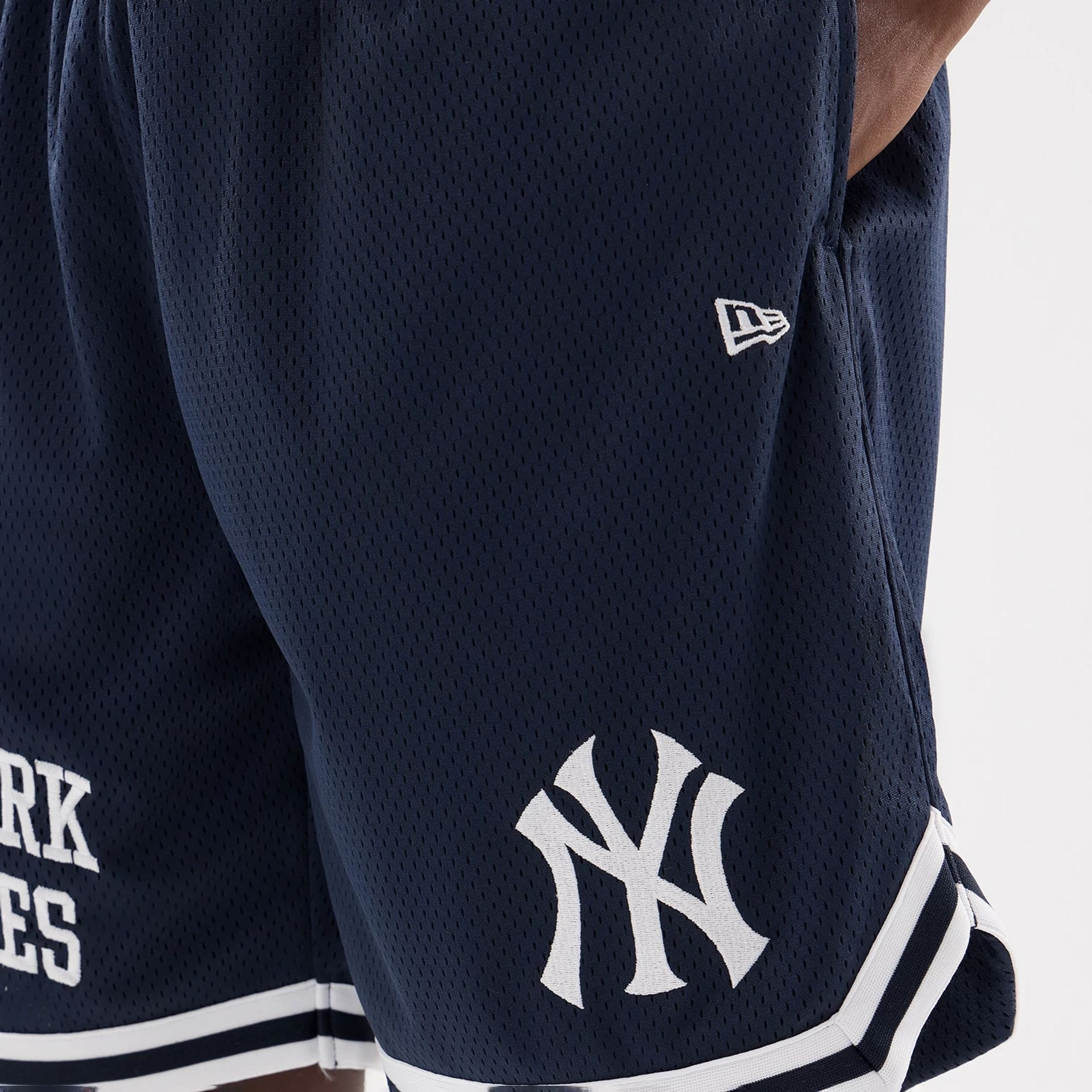 The model is wearing this MLB Comfort New York Yankees Oversized Shorts in navy. 7