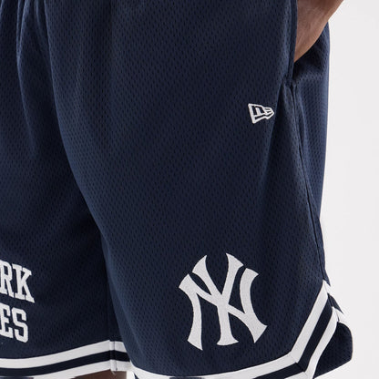 The model is wearing this MLB Comfort New York Yankees Oversized Shorts in navy. 7