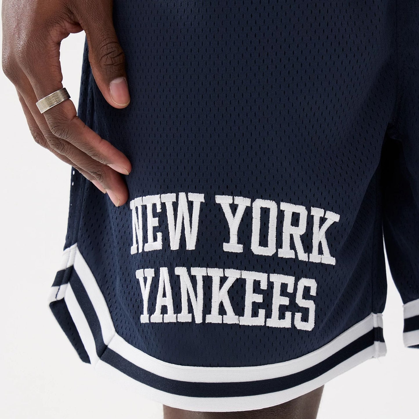 The model is wearing this MLB Comfort New York Yankees Oversized Shorts in navy. 5