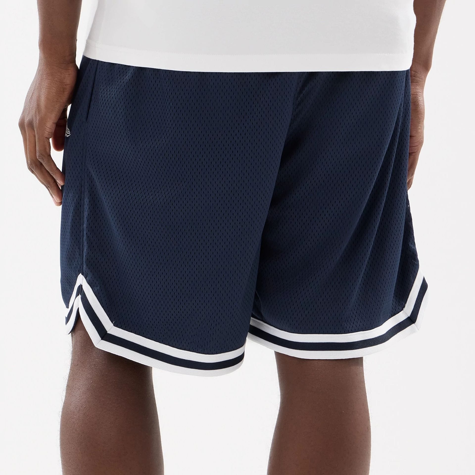 The model is wearing this MLB Comfort New York Yankees Oversized Shorts in navy. 6