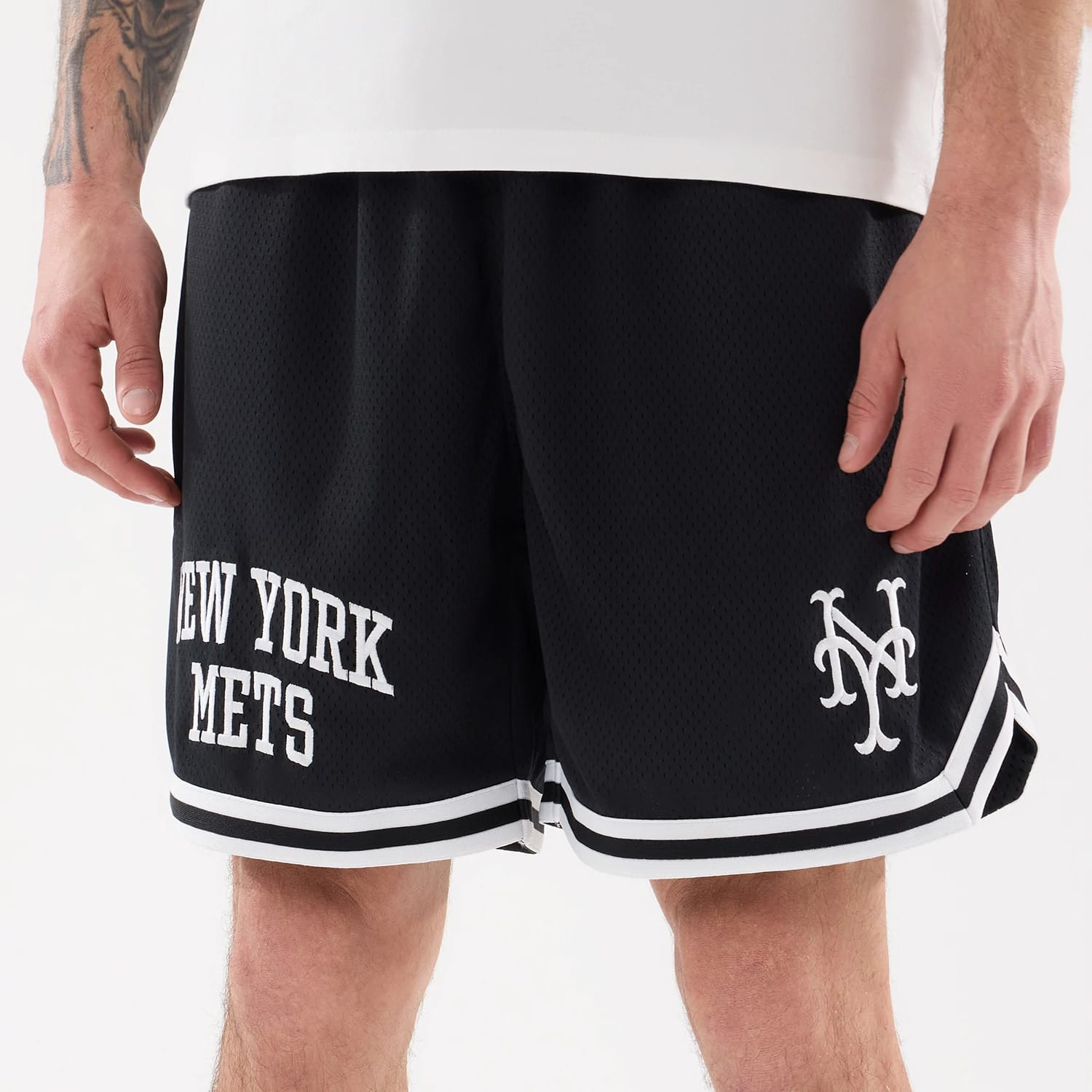 The model is wearing this MLB Comfort New York Mets Oversized Shorts in navy. 5