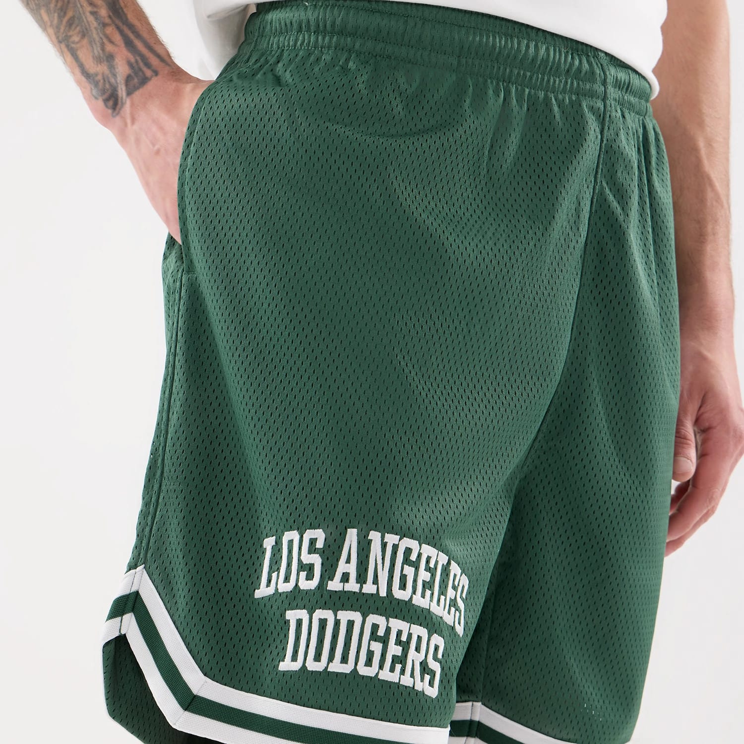 The model is wearing this MLB Comfort LA Dodgers Oversized Shorts in Dark Green. 4