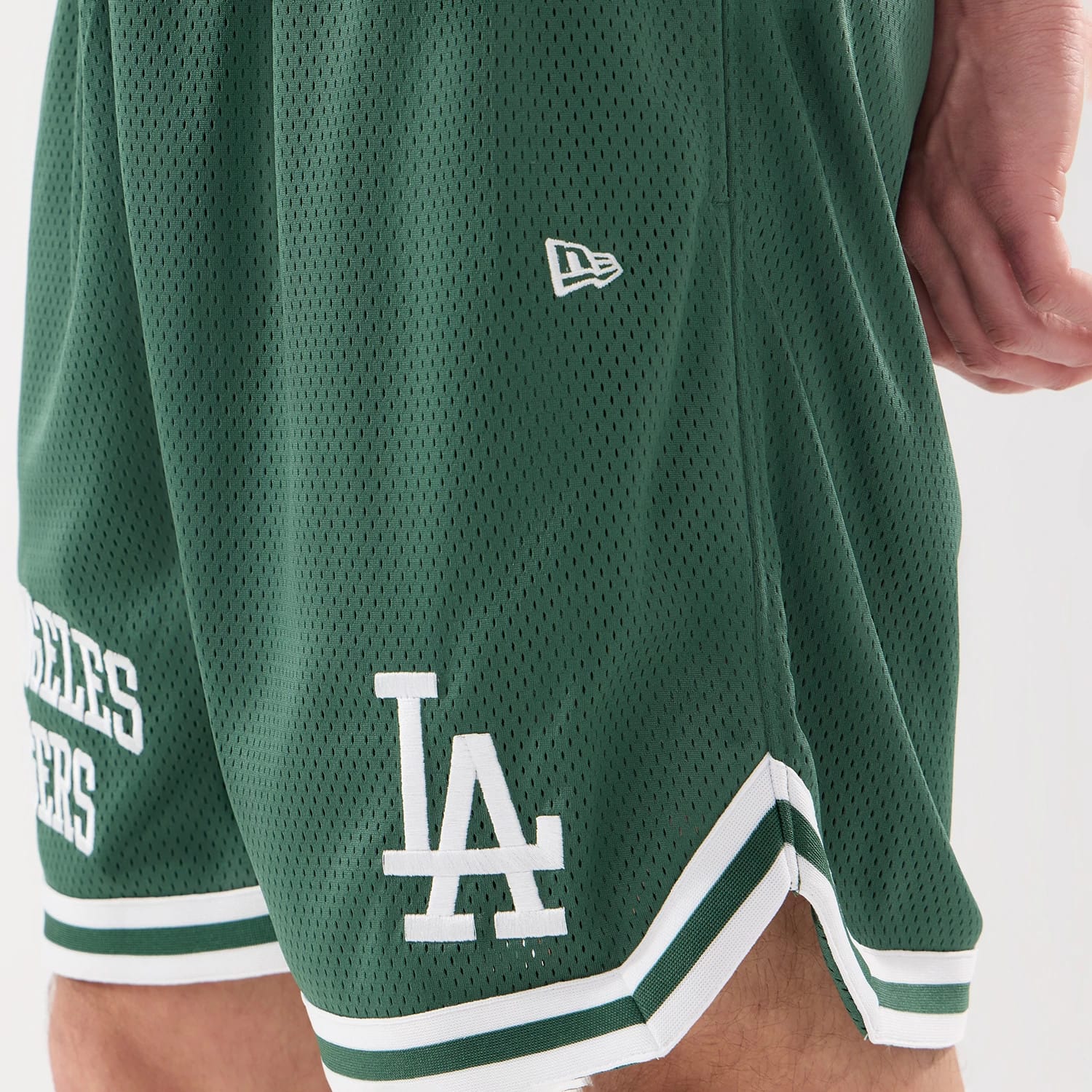 The model is wearing this MLB Comfort LA Dodgers Oversized Shorts in Dark Green. 5