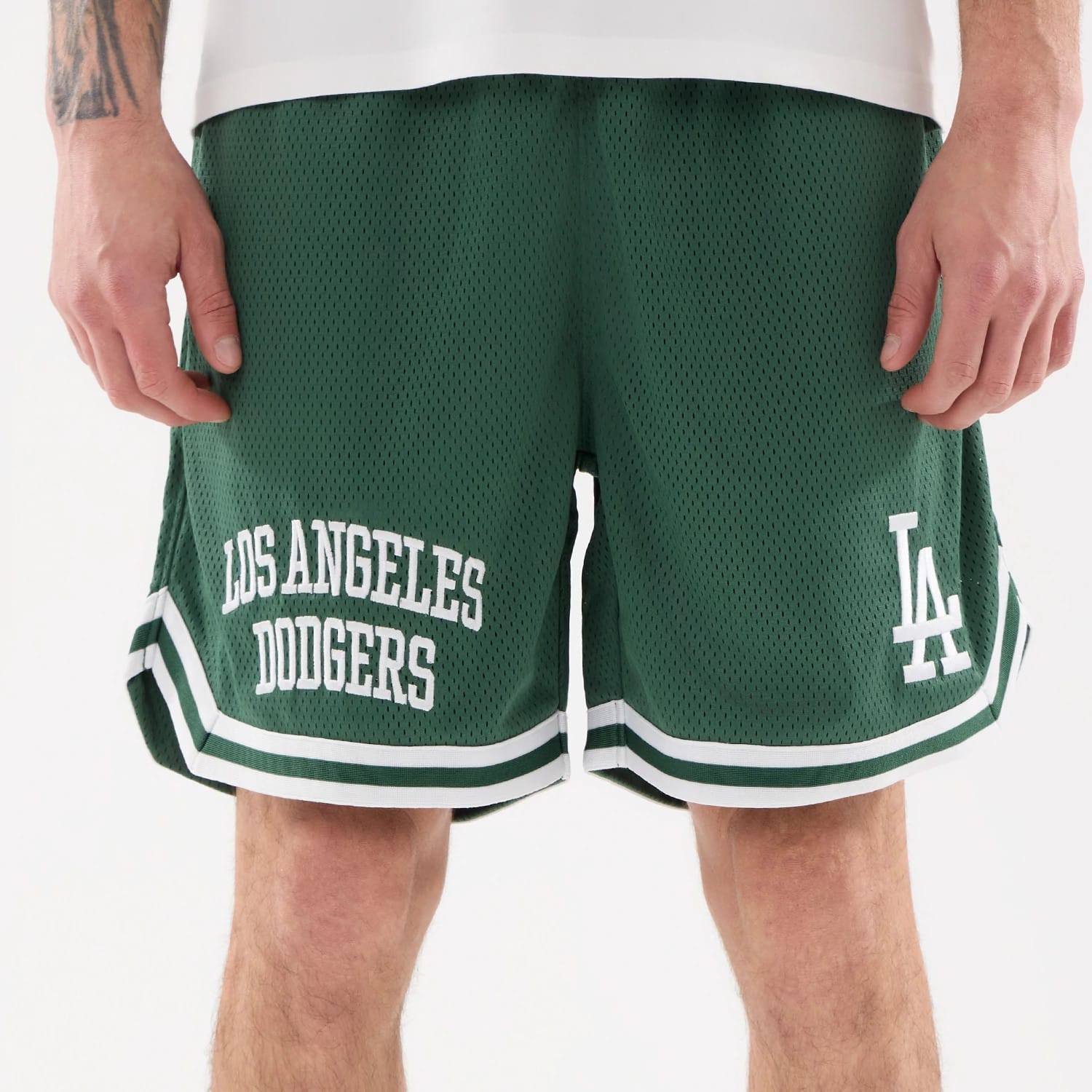 The model is wearing this MLB Comfort LA Dodgers Oversized Shorts in Dark Green. 6