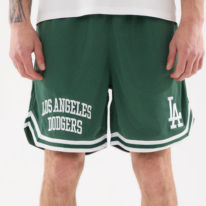 The model is wearing this MLB Comfort LA Dodgers Oversized Shorts in Dark Green. 6
