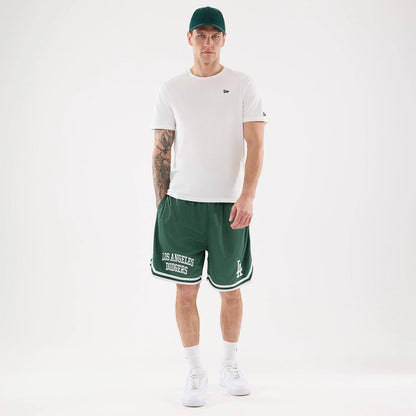The model is wearing this MLB Comfort LA Dodgers Oversized Shorts in Dark Green. 8